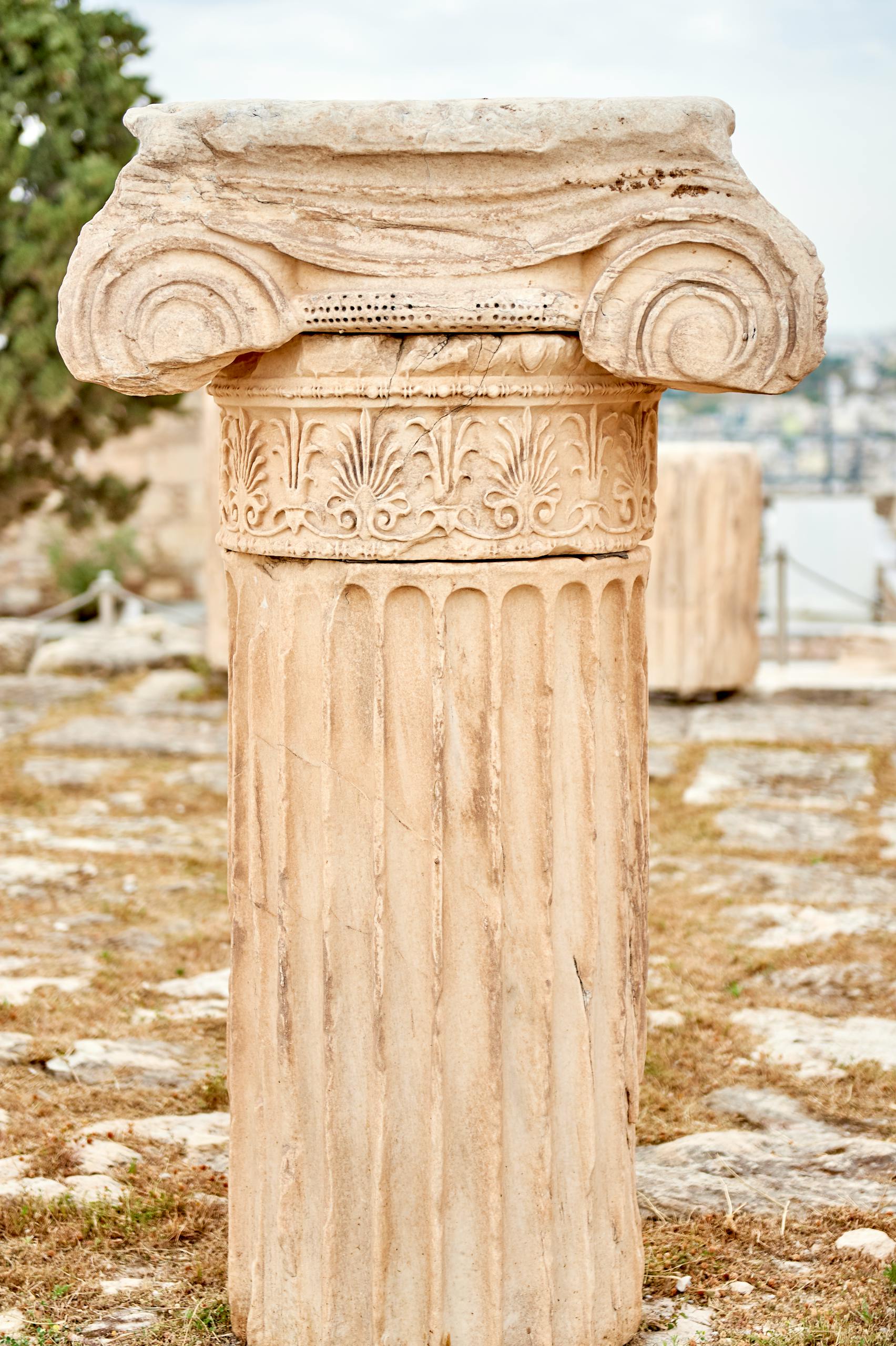 Close-up of an ancient Ionic column at the Acropolis in Athens, Greece.